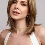 Woman with shoulder-length blonde wig from Hidden Secrets Wigs.